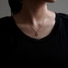 GIFTED / TINY CROSSED IMPLOSION NECKLACE YGD