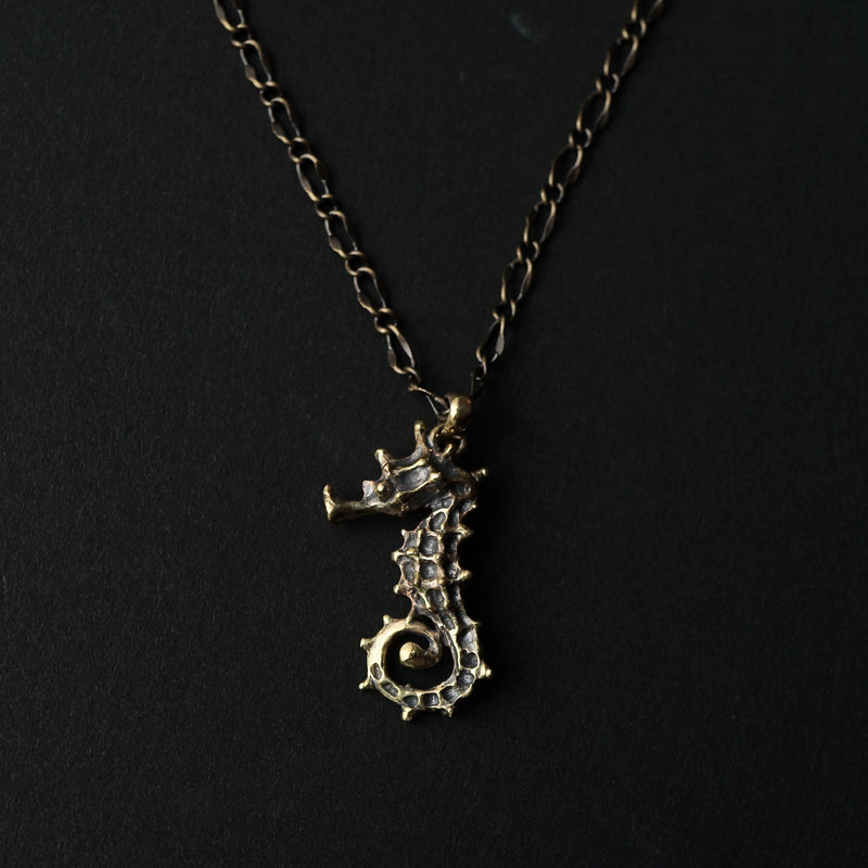 cocoon / seahorse necklace brass