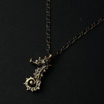 cocoon / seahorse necklace brass