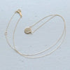 in her  K10 plate necklace