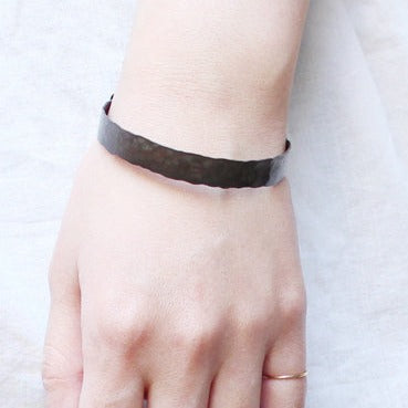 in her  Black band bangle L