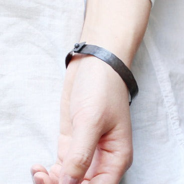 in her  Black band bangle L